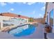 Inviting backyard pool area with a mural and desert landscaping at 3808 Lilac Haze St, Las Vegas, NV 89147