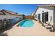 Inviting backyard pool with desert landscape and mountain mural on privacy wall at 3808 Lilac Haze St, Las Vegas, NV 89147