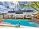 Gorgeous backyard featuring a refreshing pool, spa, and mature palm trees, ideal for relaxation and entertainment at 3916 Green Leaf Dr, Las Vegas, NV 89120