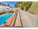 A view of backyard landscaping with steps leading to upper part of the yard and pool at 3916 Green Leaf Dr, Las Vegas, NV 89120