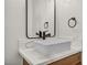 Close-up of the bathroom's vessel sink, countertop, faucet, and framed mirror at 3916 Green Leaf Dr, Las Vegas, NV 89120
