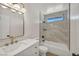 Renovated bathroom featuring sleek vanity, modern fixtures, and stylish tiled shower at 3916 Green Leaf Dr, Las Vegas, NV 89120