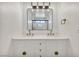 Updated bathroom with double vanity, new fixtures and mirror reflecting the shower at 3916 Green Leaf Dr, Las Vegas, NV 89120