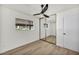 Light-filled bedroom showcasing a ceiling fan, closet, and wood-look flooring at 3916 Green Leaf Dr, Las Vegas, NV 89120
