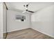 Simple bedroom featuring a ceiling fan and wood-look floors at 3916 Green Leaf Dr, Las Vegas, NV 89120