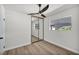 Bright bedroom features wood-look floors, ceiling fan, and closet at 3916 Green Leaf Dr, Las Vegas, NV 89120