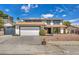 Charming two-story home featuring a two-car garage, mature landscaping, and a welcoming facade at 3916 Green Leaf Dr, Las Vegas, NV 89120