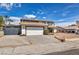 Inviting two-story home with a two-car garage and well-maintained landscaping on a sunny day at 3916 Green Leaf Dr, Las Vegas, NV 89120
