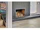 Inviting fireplace with dark mantel and brick accents next to stairs at 3916 Green Leaf Dr, Las Vegas, NV 89120