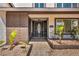 Close-up of a secure gated entrance, enhanced by lush greenery and a tiled walkway at 3916 Green Leaf Dr, Las Vegas, NV 89120