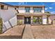 Charming front entrance featuring a secure gate, tiled walkway, and well-maintained garden at 3916 Green Leaf Dr, Las Vegas, NV 89120