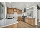 Modern kitchen boasting stainless steel appliances, quartz counters and bright open floor plan at 3916 Green Leaf Dr, Las Vegas, NV 89120