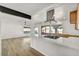 Modern kitchen features white countertops, stainless steel appliances, and an open layout to the living area at 3916 Green Leaf Dr, Las Vegas, NV 89120