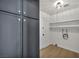 A laundry room with plenty of storage, featuring sleek cabinetry and convenient shelving at 3916 Green Leaf Dr, Las Vegas, NV 89120