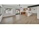 Spacious living area with seamless access to the kitchen and a view of the backyard pool at 3916 Green Leaf Dr, Las Vegas, NV 89120