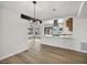 Open-concept living room boasts sleek floors, modern lighting, and seamless flow to the kitchen at 3916 Green Leaf Dr, Las Vegas, NV 89120