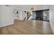 Open-concept living space featuring sleek fireplace, staircase, and modern flooring at 3916 Green Leaf Dr, Las Vegas, NV 89120