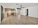 Bright and open living space, featuring stainless steel appliances, wood-look floors, and modern lighting at 3916 Green Leaf Dr, Las Vegas, NV 89120