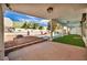 Inviting outdoor patio area with a pool, artificial turf, and ample space for entertaining at 3916 Green Leaf Dr, Las Vegas, NV 89120