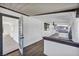 Enclosed patio with wood-look flooring, ceiling fan, and view into main house at 3916 Green Leaf Dr, Las Vegas, NV 89120
