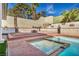 Inground pool, spa, waterfall, and fire pit at 3916 Green Leaf Dr, Las Vegas, NV 89120