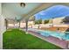 A covered patio overlooks the backyard pool and spa area at 3916 Green Leaf Dr, Las Vegas, NV 89120