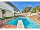 In-ground swimming pool with diving board and surrounding landscaping at 3916 Green Leaf Dr, Las Vegas, NV 89120