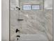 Close-up of updated shower with modern tile and matte black shower head at 3916 Green Leaf Dr, Las Vegas, NV 89120