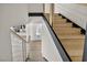 Modern staircase with wood steps and cable railing leading to the front door at 3916 Green Leaf Dr, Las Vegas, NV 89120