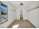 A walk-in closet has modern lighting, new floors and built-in shelving at 3916 Green Leaf Dr, Las Vegas, NV 89120