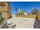 Spacious backyard featuring a concrete pad and block walls, offering privacy and potential for customization at 4 Bishopsgate Ter, Henderson, NV 89074