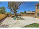 Backyard pool with a rock waterfall feature, ample concrete decking, and partial lawn space at 4 Bishopsgate Ter, Henderson, NV 89074