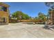 Backyard showcasing a pool with rock feature, surrounded by concrete decking and a small lawn area at 4 Bishopsgate Ter, Henderson, NV 89074