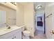 Well-lit bathroom featuring modern fixtures, white vanity, and tile flooring for a clean and stylish design at 4 Bishopsgate Ter, Henderson, NV 89074