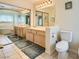 Bright bathroom with double sinks, vanity and a mirrored closet at 4 Bishopsgate Ter, Henderson, NV 89074