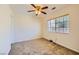 Empty bedroom with carpet, ceiling fan and a window at 4 Bishopsgate Ter, Henderson, NV 89074