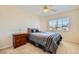 Cozy bedroom with neutral walls, a ceiling fan, and natural light from the window at 4 Bishopsgate Ter, Henderson, NV 89074