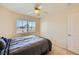 Relaxing bedroom with a fan, a window, neutral carpet, and a closet at 4 Bishopsgate Ter, Henderson, NV 89074