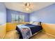 Cheerful bedroom featuring a fan, large window, and neutral carpet at 4 Bishopsgate Ter, Henderson, NV 89074
