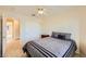 Comfortable bedroom with a fan, double closet, neutral carpet, and decor at 4 Bishopsgate Ter, Henderson, NV 89074