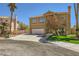 Charming two-story residence with a landscaped front yard and an attached two-car garage at 4 Bishopsgate Ter, Henderson, NV 89074