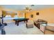 Bright game room features a pool table, comfortable seating, and a ceiling fan for a relaxed atmosphere at 4 Bishopsgate Ter, Henderson, NV 89074