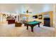 Large game room with a pool table, bar, and television at 4 Bishopsgate Ter, Henderson, NV 89074