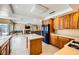 Open kitchen with an island, stainless steel appliances, and access to living room at 4 Bishopsgate Ter, Henderson, NV 89074