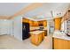Spacious kitchen with an island, tile floors, and stainless steel appliances at 4 Bishopsgate Ter, Henderson, NV 89074