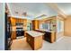 Kitchen with island, tile floors, stainless steel appliances, and great natural light at 4 Bishopsgate Ter, Henderson, NV 89074