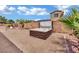 Backyard featuring a hot tub surrounded by decorative rock and a privacy wall at 4330 Oasis Hill Ave, North Las Vegas, NV 89085