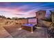 Backyard featuring a hot tub and built in outdoor kitchen area at 4330 Oasis Hill Ave, North Las Vegas, NV 89085