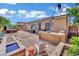 Large backyard featuring a hot tub, a built-in outdoor kitchen, and a firepit at 4330 Oasis Hill Ave, North Las Vegas, NV 89085