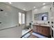 Modern bathroom boasts a glass shower, wood-look tile floors, and a double sink vanity at 4330 Oasis Hill Ave, North Las Vegas, NV 89085